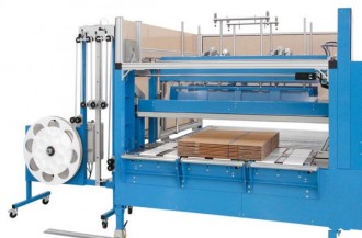 Machine de mise sous bande de carton ondulé